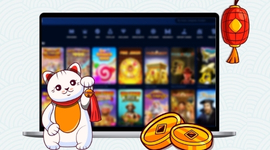 A graphic of a lucky cat next to a laptop displaying a variety of online casino games.