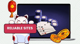 A white lucky cat holding a red sign that says 