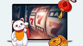 A graphic showing a lucky cat next to a laptop displaying a digital slot machine.