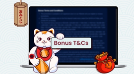 A white lucky cat holding a sign that says Bonus T&Cs next to a laptop.